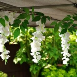 Solar Powered 180cm Artificial Leaf Garland With Wisteria Flowers - Warm White -Garden Decoration Shop 379258 180cm solar powered artificial leaf garland with wisteria flowers 20 warm white micro leds